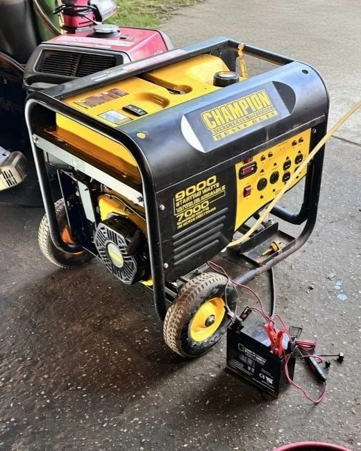 Champion 9000-watt portable generator during an oil change