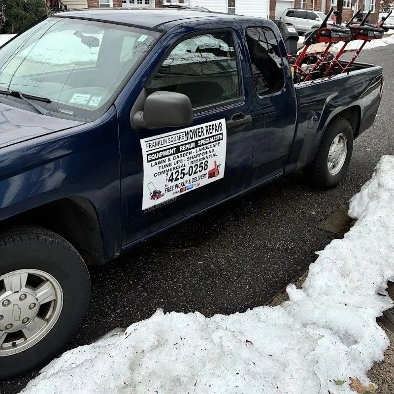 Franklin Square Mower Repair pickup truck loaded with snowblowers for delivery