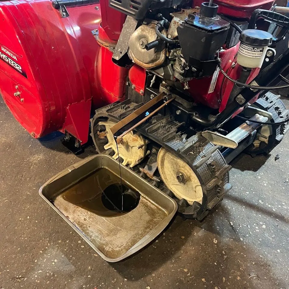 Honda track snowblower during an oil change
